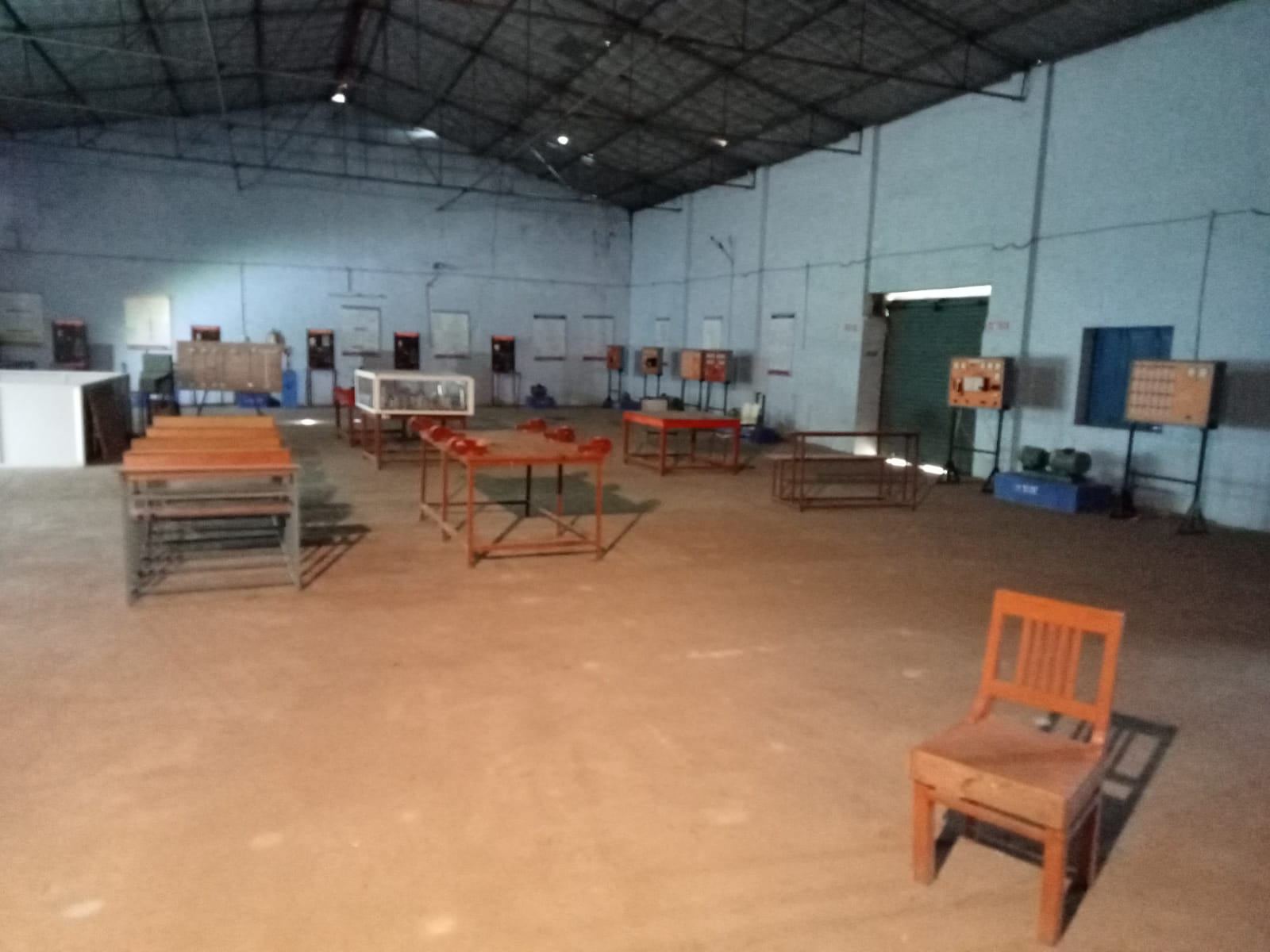 Wide view of electrical lab with training benches and equipment